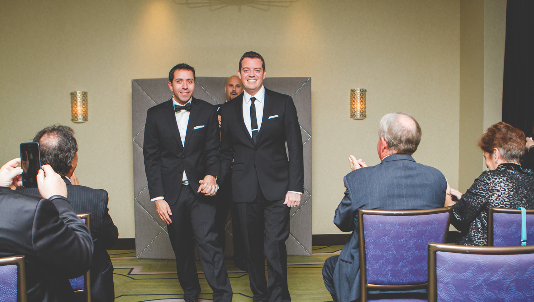 Two grooms who just got married at Kimpton Hotel Palomar Philadelphia