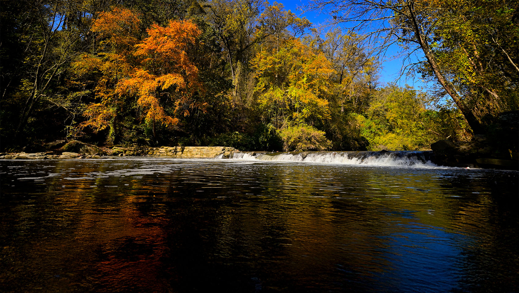 Fall nears it peak at the waterfall near the historic Glen Fern house in the Wissahickon Valley section of Fairmount Park, in Northwest Philadelphia, Pennsylvania