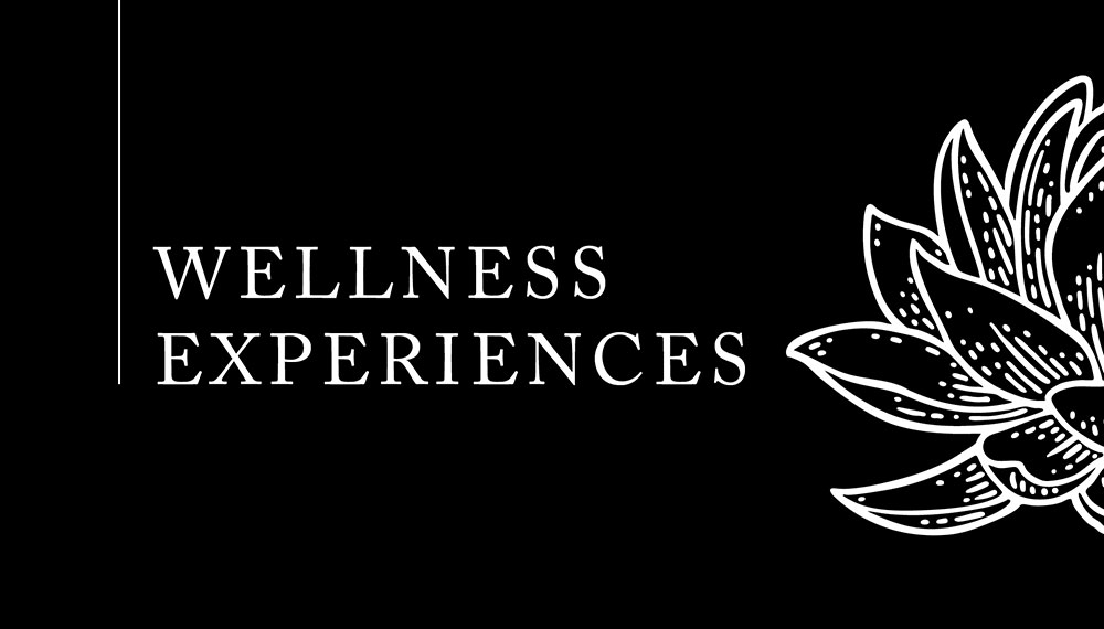 Black graphic that says Wellness Experiences