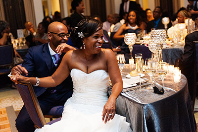 Bride and Groom at table smiling