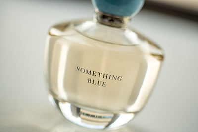 bottle of perfumse with the words Something Blue